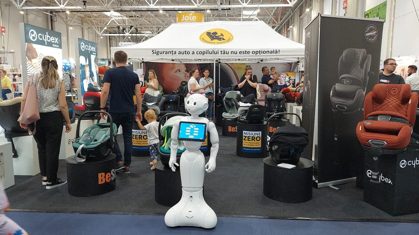 Pepper at an exhibition booth, surrounded by visitors